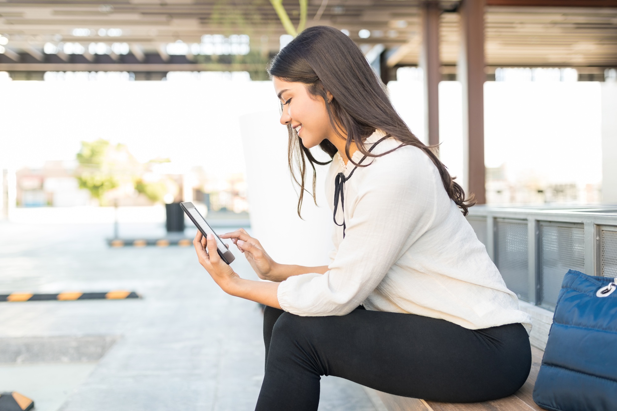 Entrepreneur Using E-Reader Outside Office