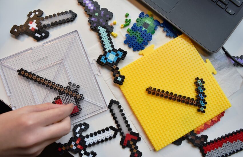 Hobby flat lay. Minecraft inspired pixel art with fusible beads flatlay dexterity fine motor skills