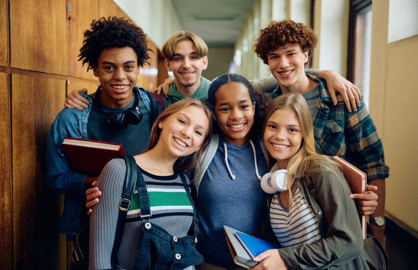Portrait of happy high school students looking at camera.