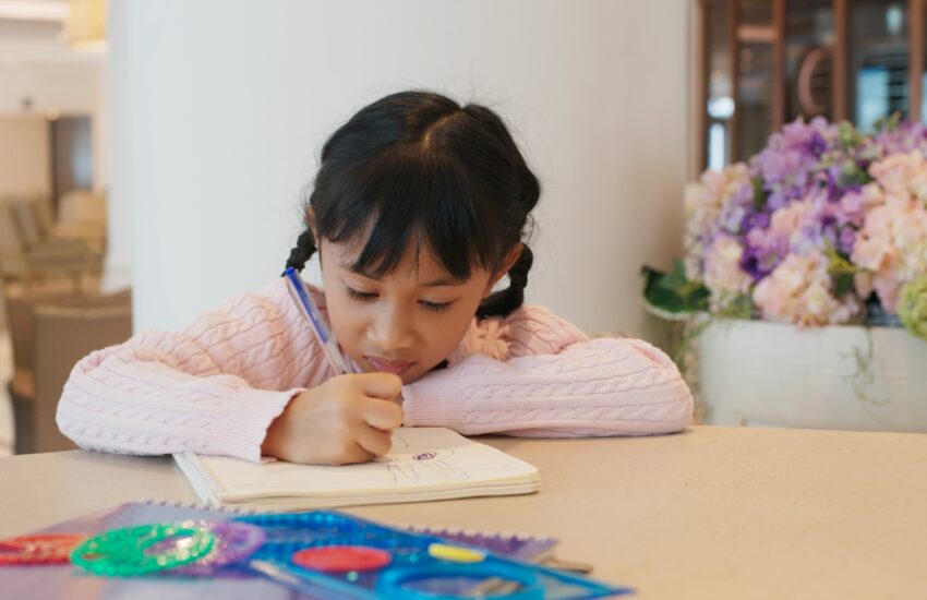 Kid draw on the book