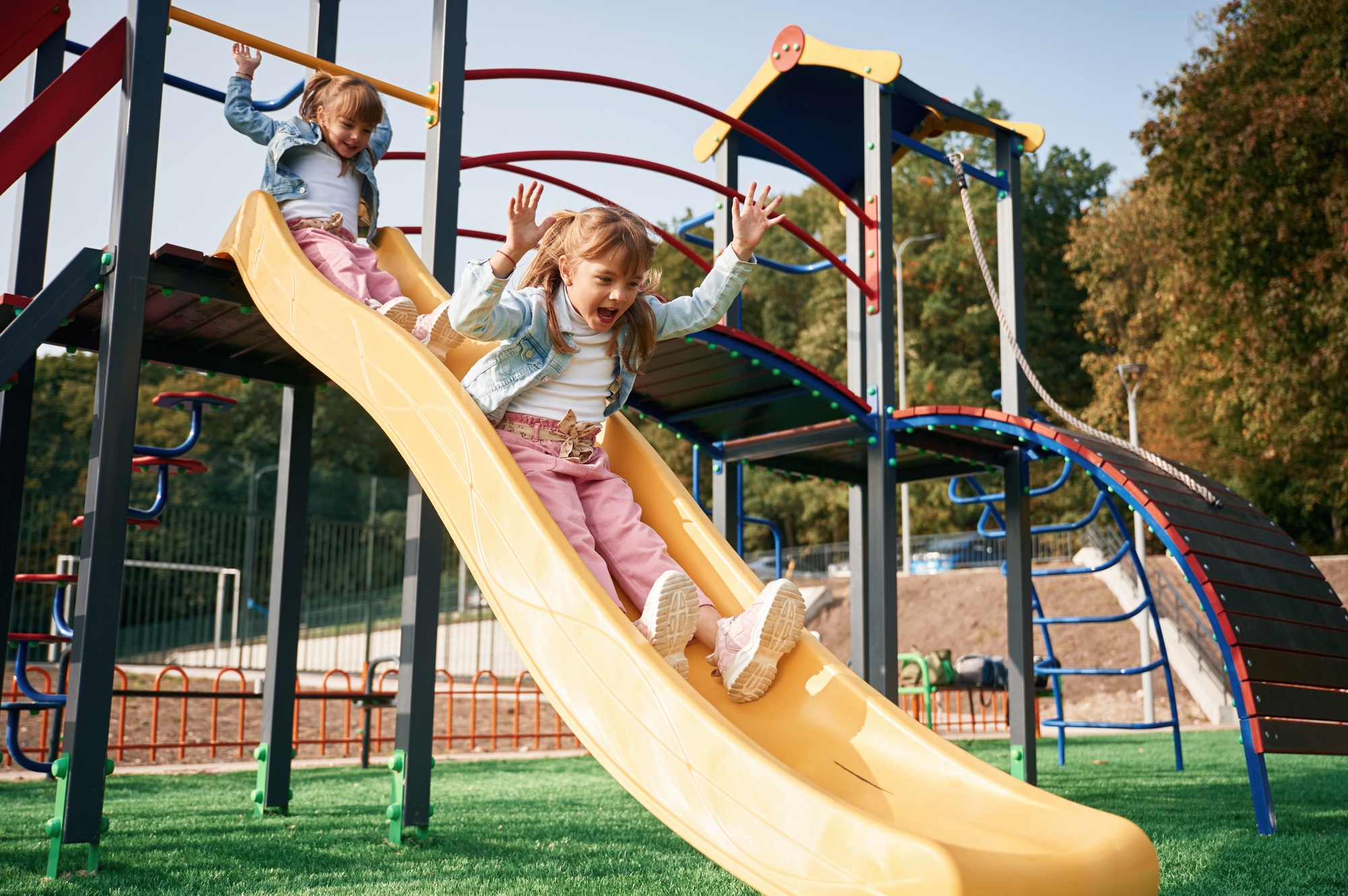 On the playground slide. Kids are having fun